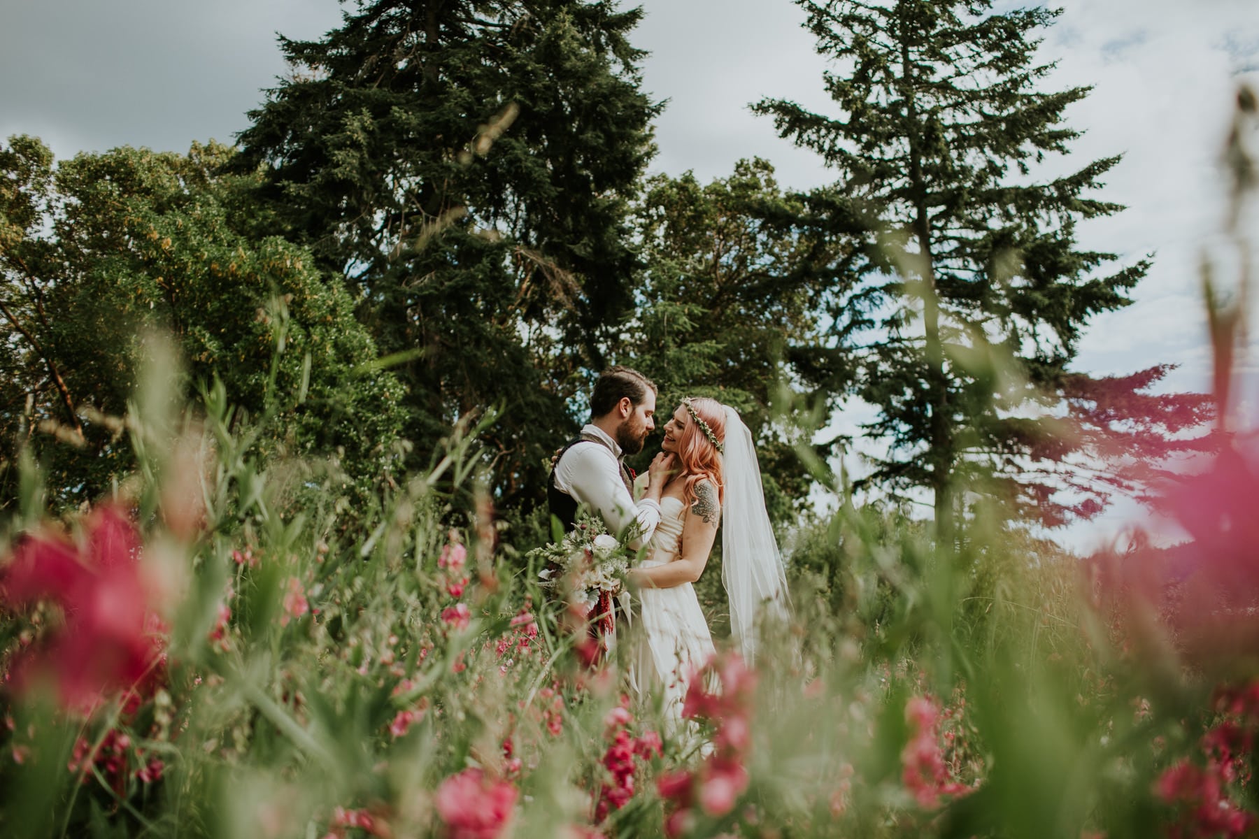 bride and groom in flower field orcas island wedding