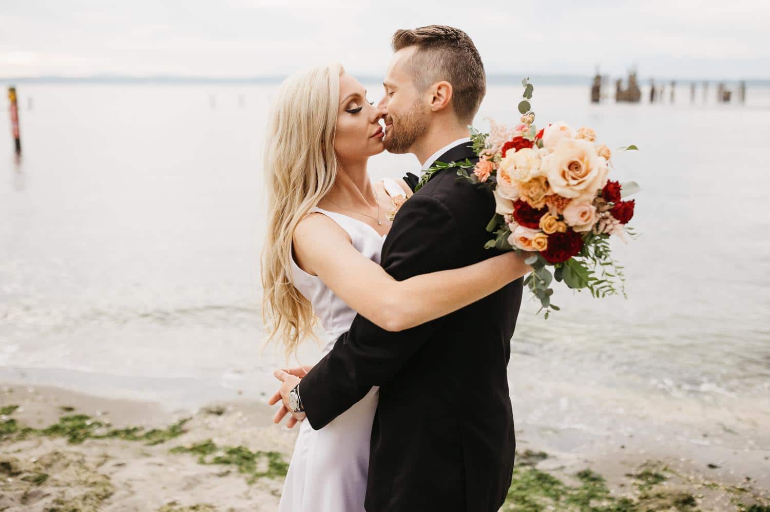 wedding portraits on beach at ballard bay club