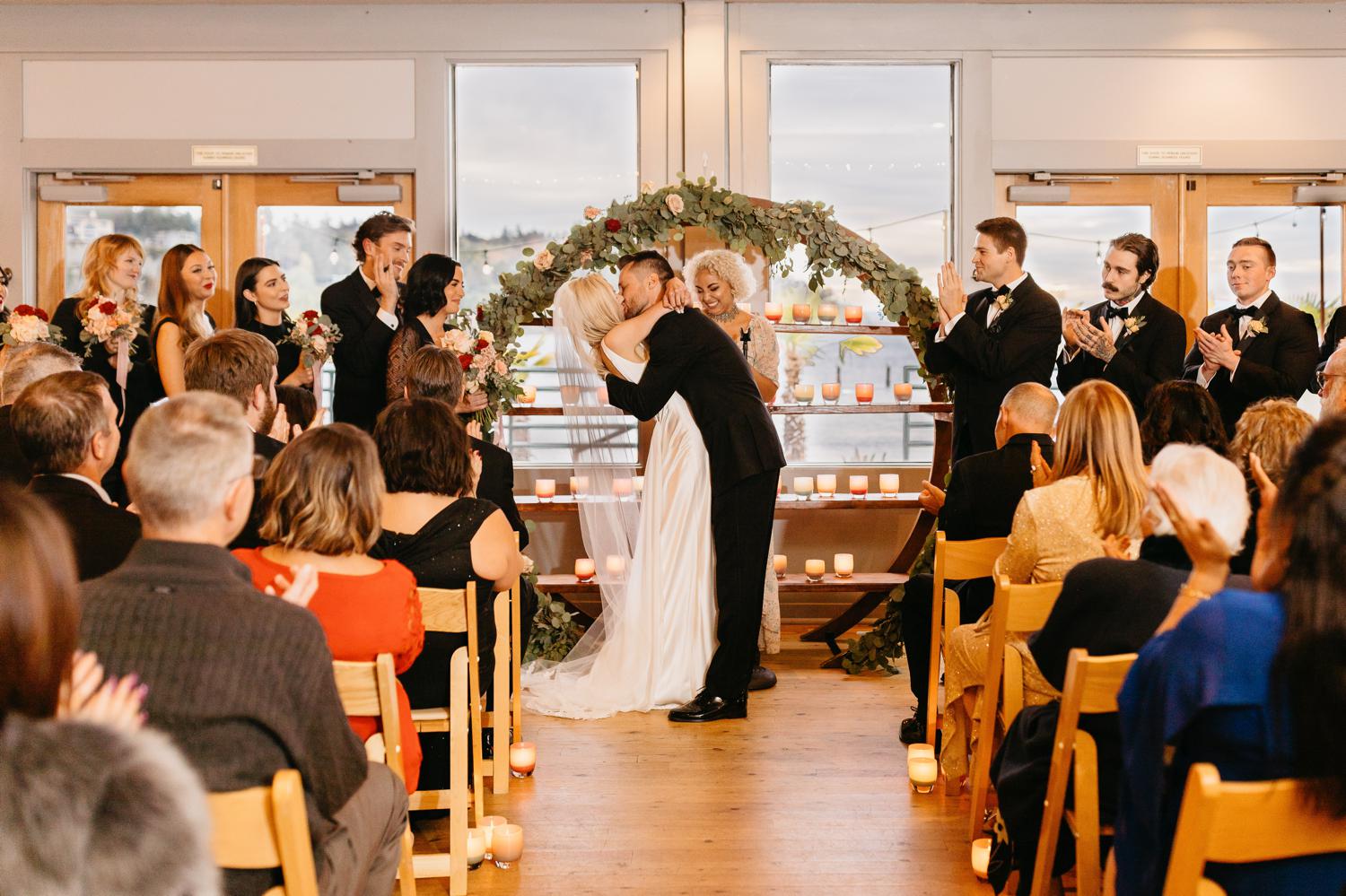 indoor wedding ceremony at ballard bay club