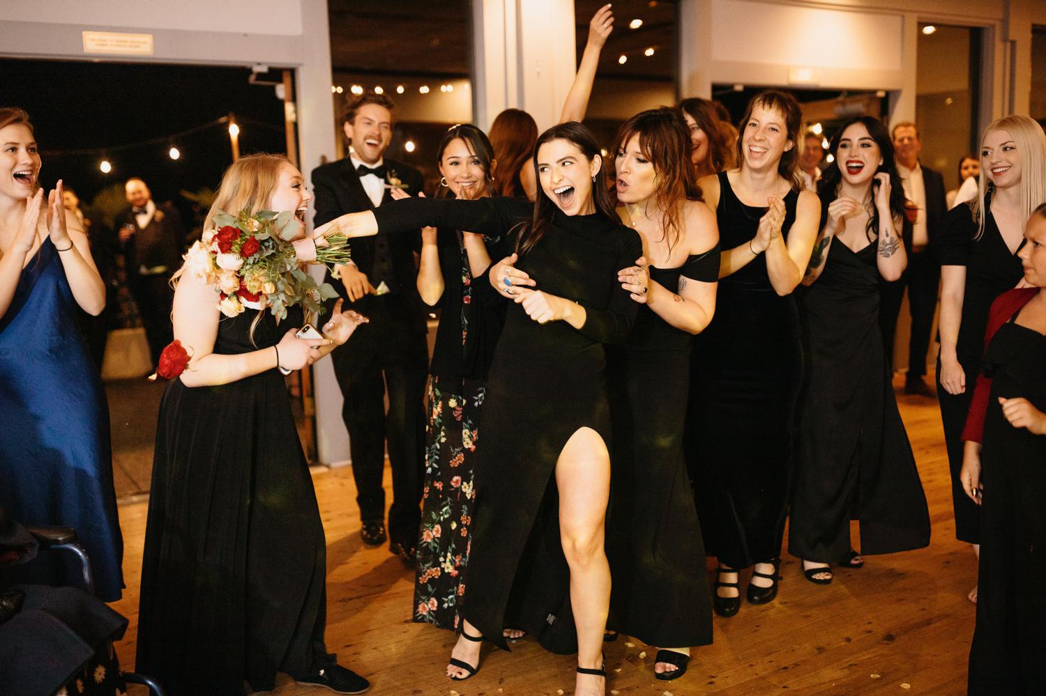 bouquet toss at ballard bay club