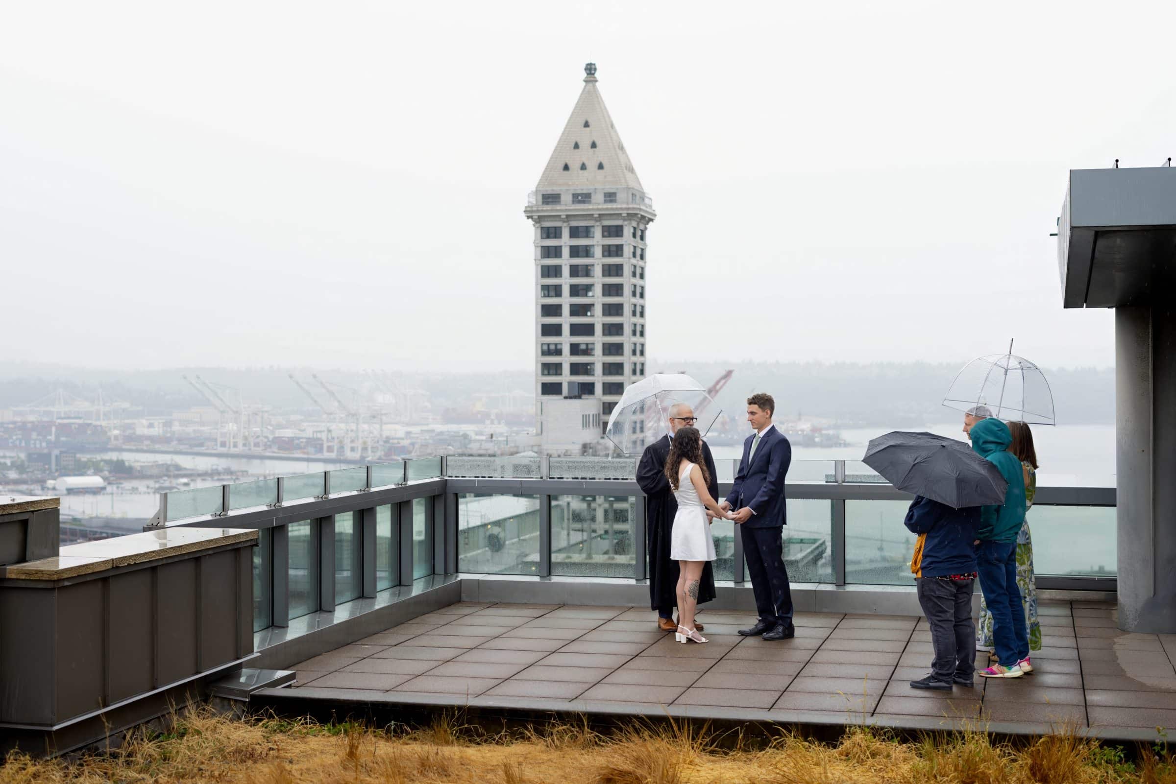 seattle courthouse wedding on the rooftop in the rain
